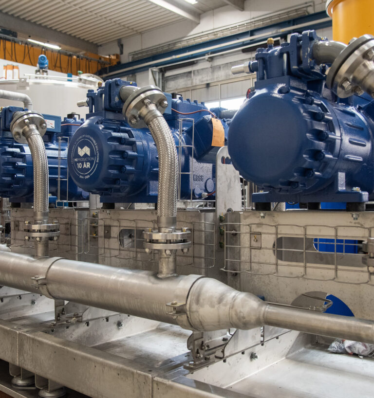 ME Production blue compressors with 10-year logo